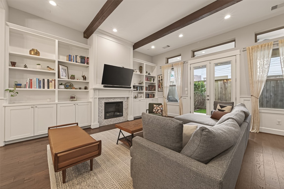 604 West Pierce Street Houston, TX 77019 - Photo 6 of 33 a living room with furniture a flat screen tv and a fireplace