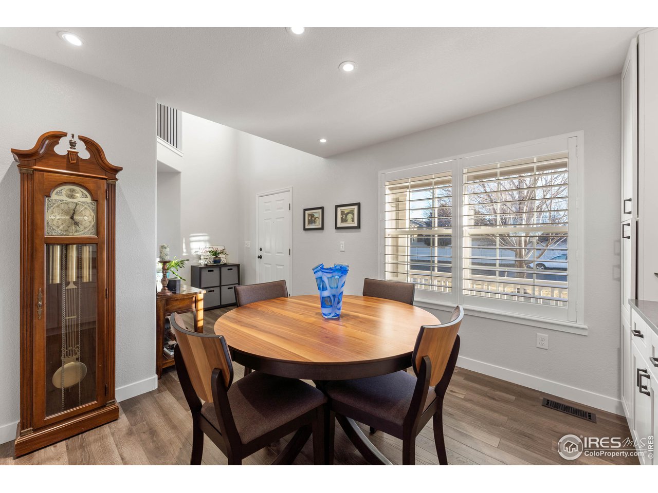 6607 Echo Circle Firestone, CO 80504 - Photo 11 of 40 a view of a dining room with furniture window and wooden floor