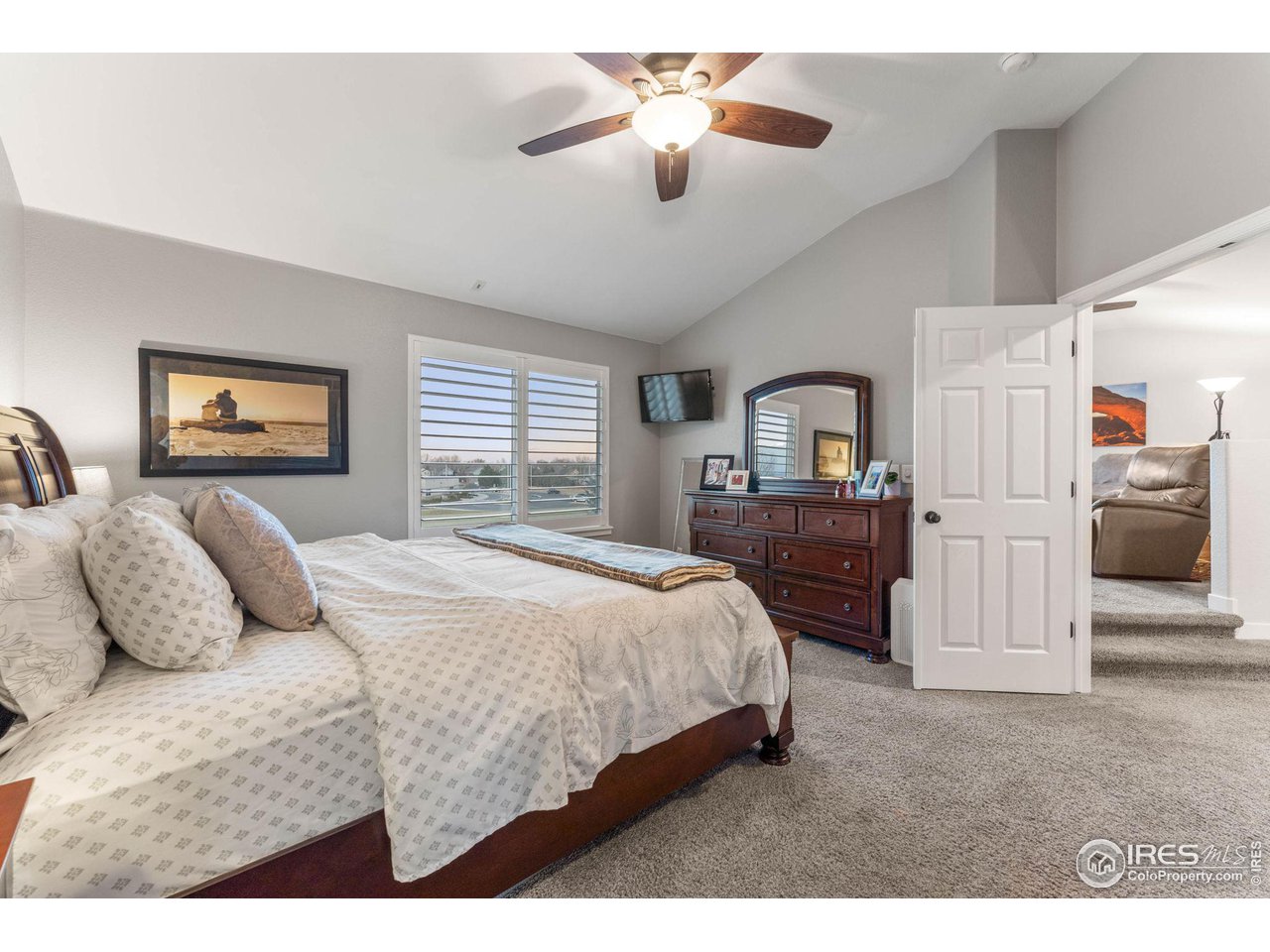 6607 Echo Circle Firestone, CO 80504 - Photo 16 of 40 a bedroom with a bed and a large window