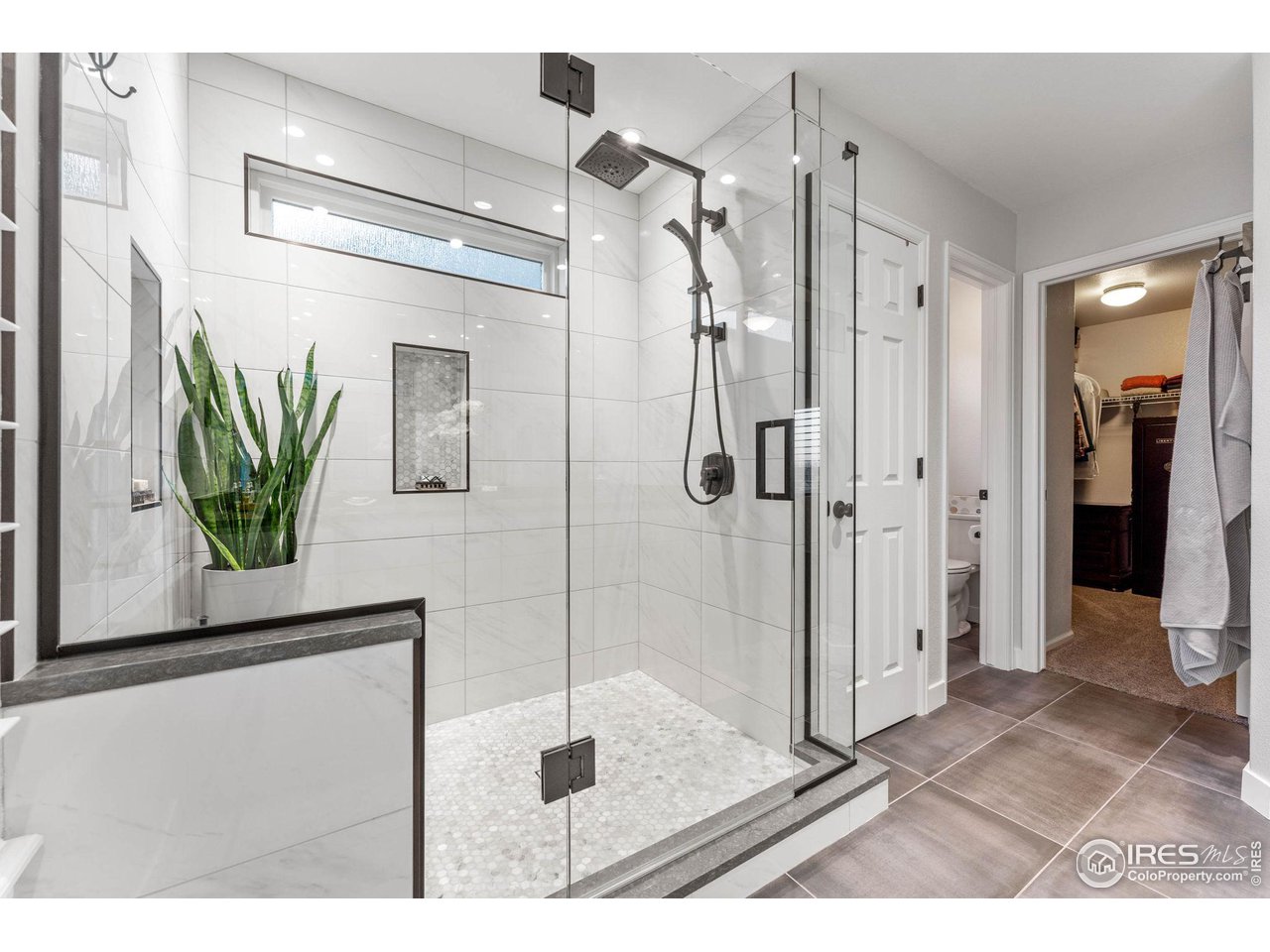 6607 Echo Circle Firestone, CO 80504 - Photo 17 of 40 a bathroom with a shower and a sink