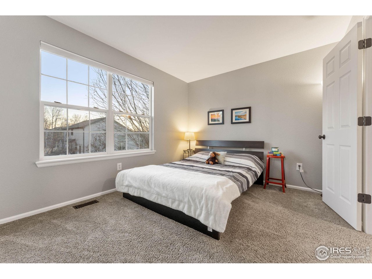 6607 Echo Circle Firestone, CO 80504 - Photo 19 of 40 a bedroom with bed and a window