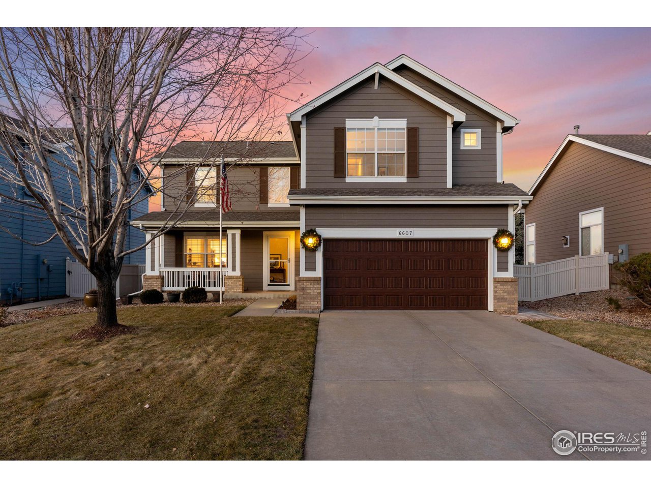 6607 Echo Circle Firestone, CO 80504 - Photo 2 of 40 a front view of a house with a yard