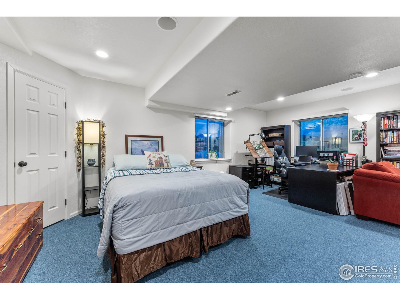 6607 Echo Circle Firestone, CO 80504 - Photo 24 of 40 a bed room with furniture and a table