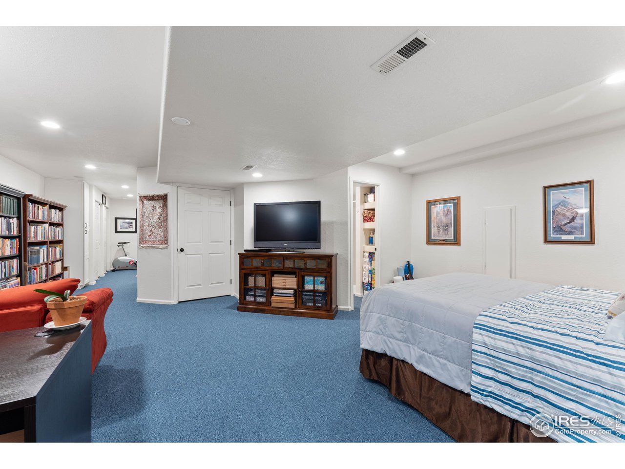 6607 Echo Circle Firestone, CO 80504 - Photo 25 of 40 a living room with furniture and a flat screen tv