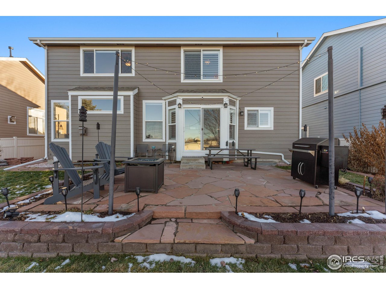 6607 Echo Circle Firestone, CO 80504 - Photo 28 of 40 a view of a dinning table and chairs in the patio
