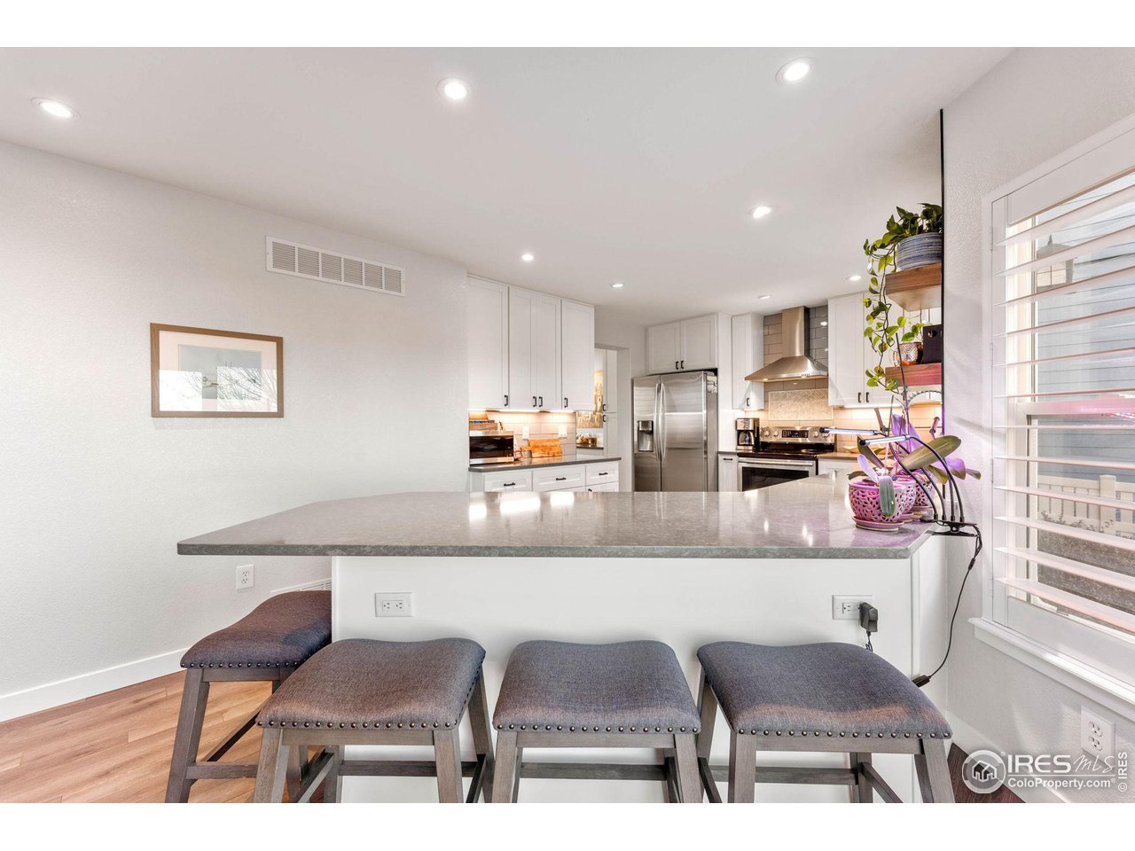 6607 Echo Circle Firestone, CO 80504 - Photo 5 of 40 a dining room with furniture a couch and kitchen view