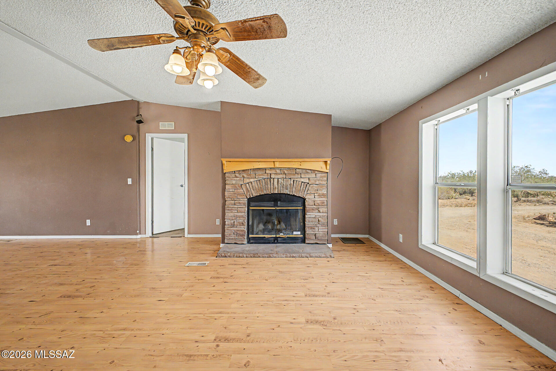 1911 West Thunder Road Vail, AZ 85641 - Photo 10 of 38 a view of an empty room with window and chandelier fan