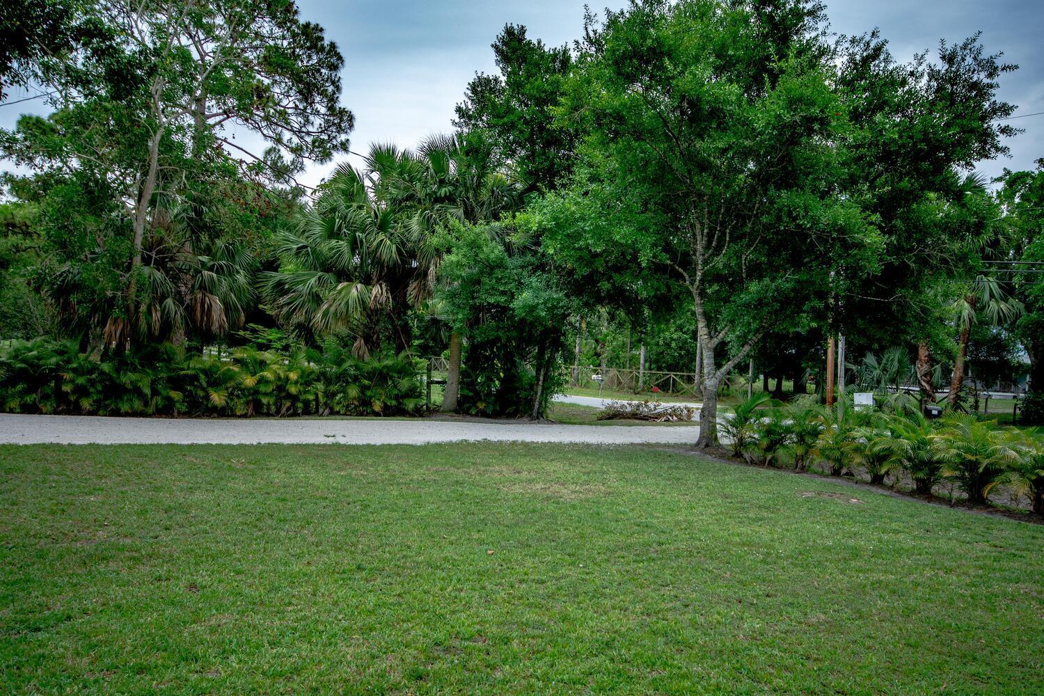 9709 154th Road North Jupiter, FL 33478 - Photo 3 of 37 Gravel Driveway