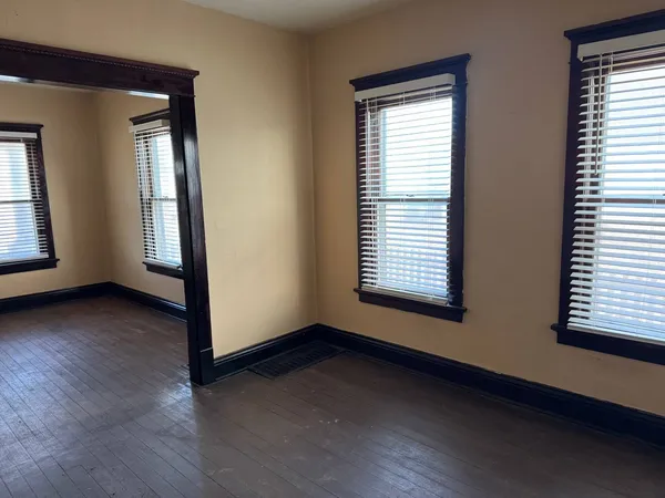 a living room with furniture window and flat screen tv