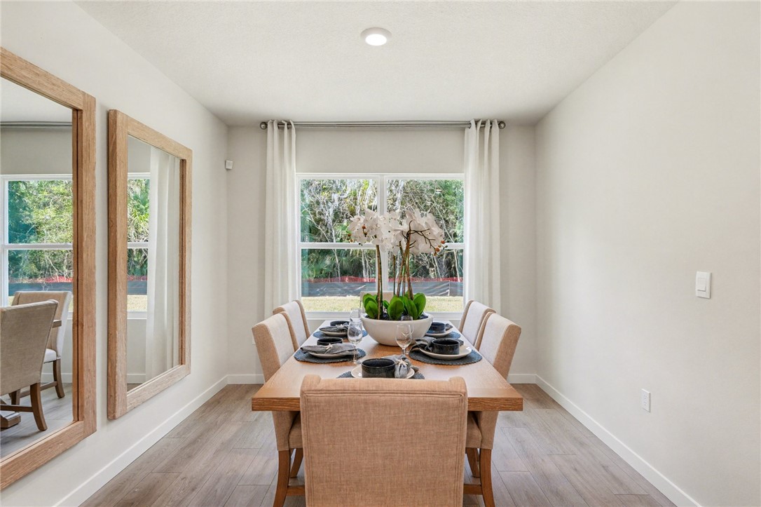 793 George Street Sebastian, FL 32958 - Photo 12 of 22 a view of a room with a table and chairs
