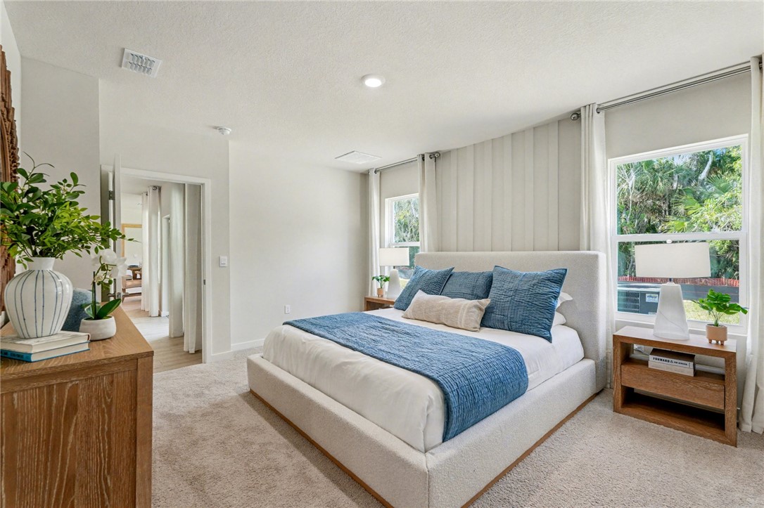 793 George Street Sebastian, FL 32958 - Photo 18 of 22 a bedroom with a bed and a couch