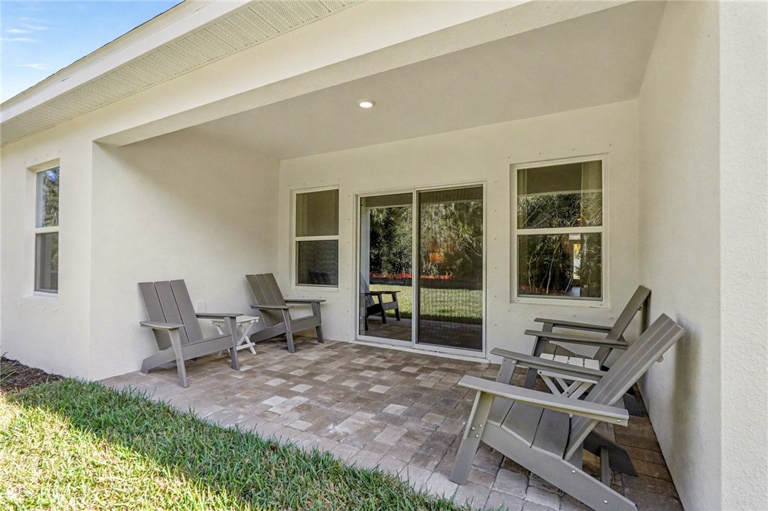 793 George Street Sebastian, FL 32958 - Photo 22 of 22 a living room with furniture and large windows