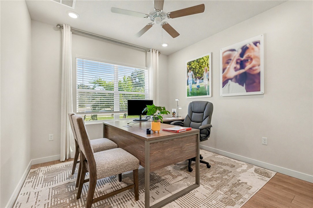 793 George Street Sebastian, FL 32958 - Photo 4 of 22 a view of a workspace with furniture and a window