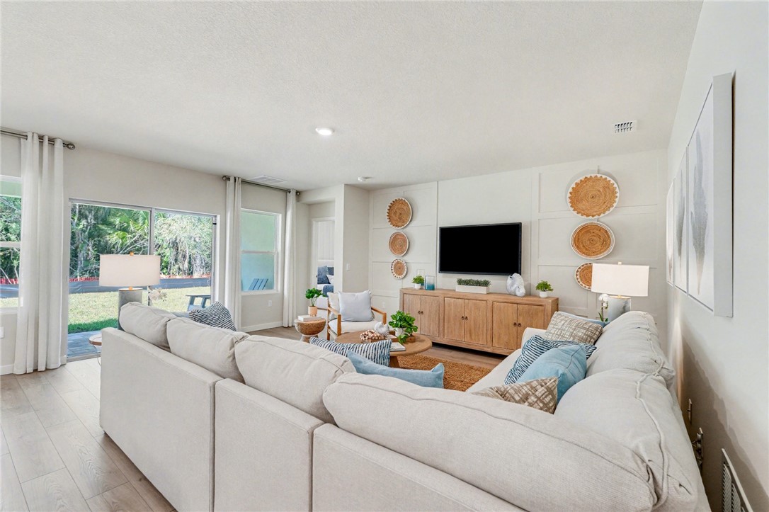 793 George Street Sebastian, FL 32958 - Photo 6 of 22 a living room with furniture and a flat screen tv