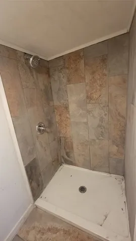 a bathroom with a sink a mirror and bathtub