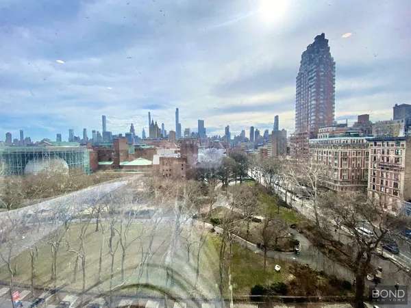 a view of a city with tall buildings