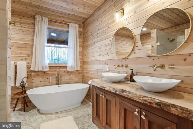 a living room with stainless steel appliances kitchen island granite countertop furniture and a view of kitchen