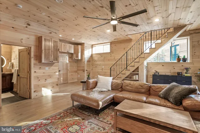 a bedroom with a bed and a flat tv screen