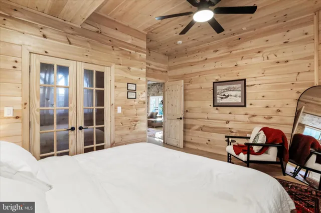 a view of a yard with large trees