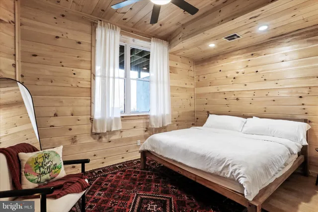 a view of a patio with table and chairs and potted plants