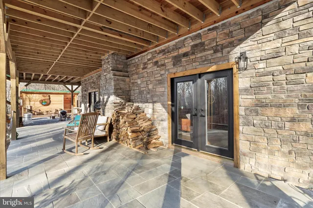 a view of a dry yard with mountains in the background