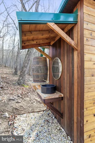 a view of backyard of a house with outdoor seating
