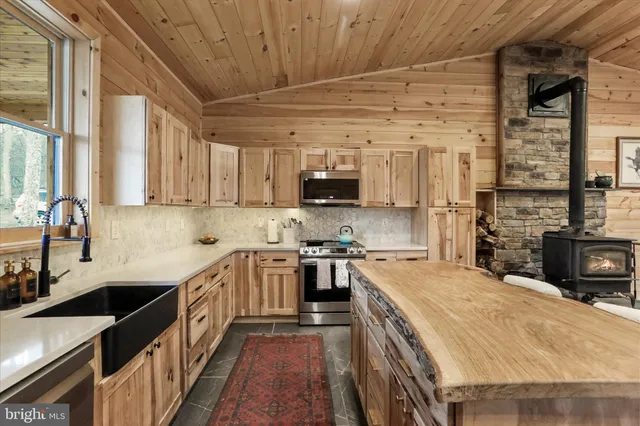 a spacious bedroom with a bed and a dresser