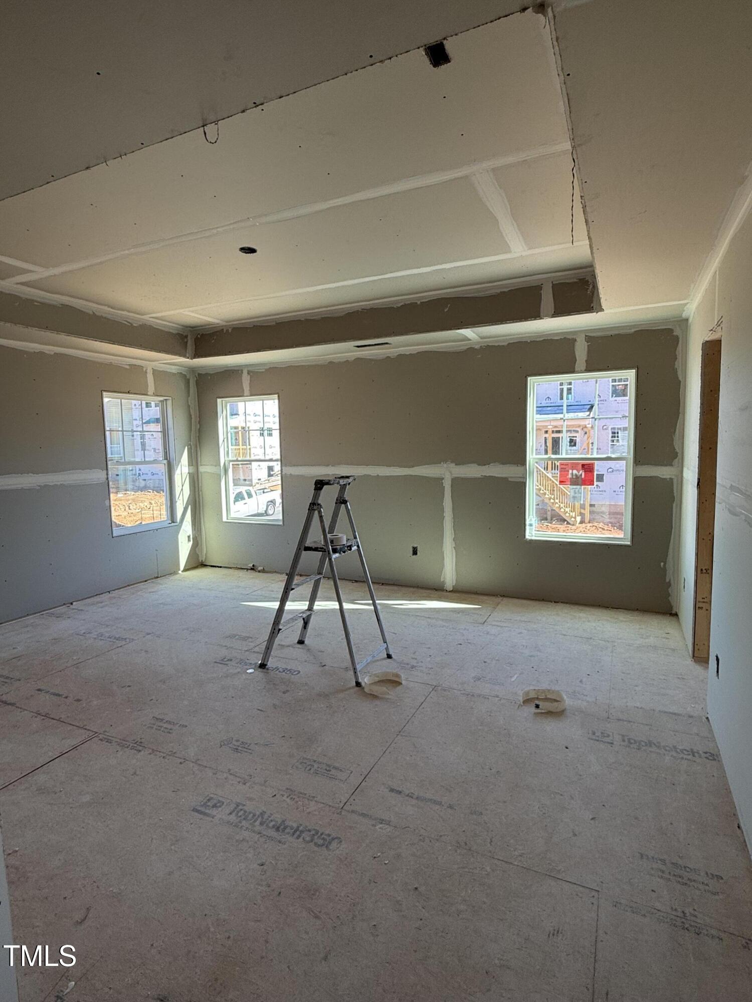 2383 Englemann Drive Apex, NC 27502 - Photo 4 of 14 a living room with a gym equipment and a window