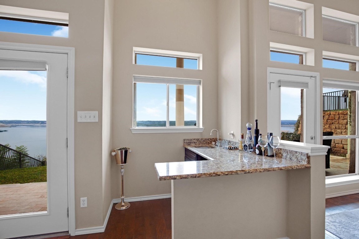 2918 Ranch Road 620 North, Unit L177 Austin, TX 78734 - Photo 11 of 40 a bathroom with a granite countertop sink and a mirror