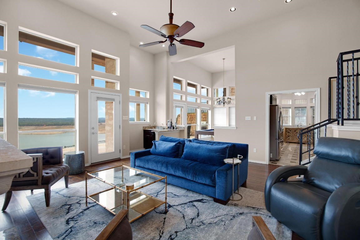 2918 Ranch Road 620 North, Unit L177 Austin, TX 78734 - Photo 12 of 40 a living room with furniture a ceiling fan and a large window