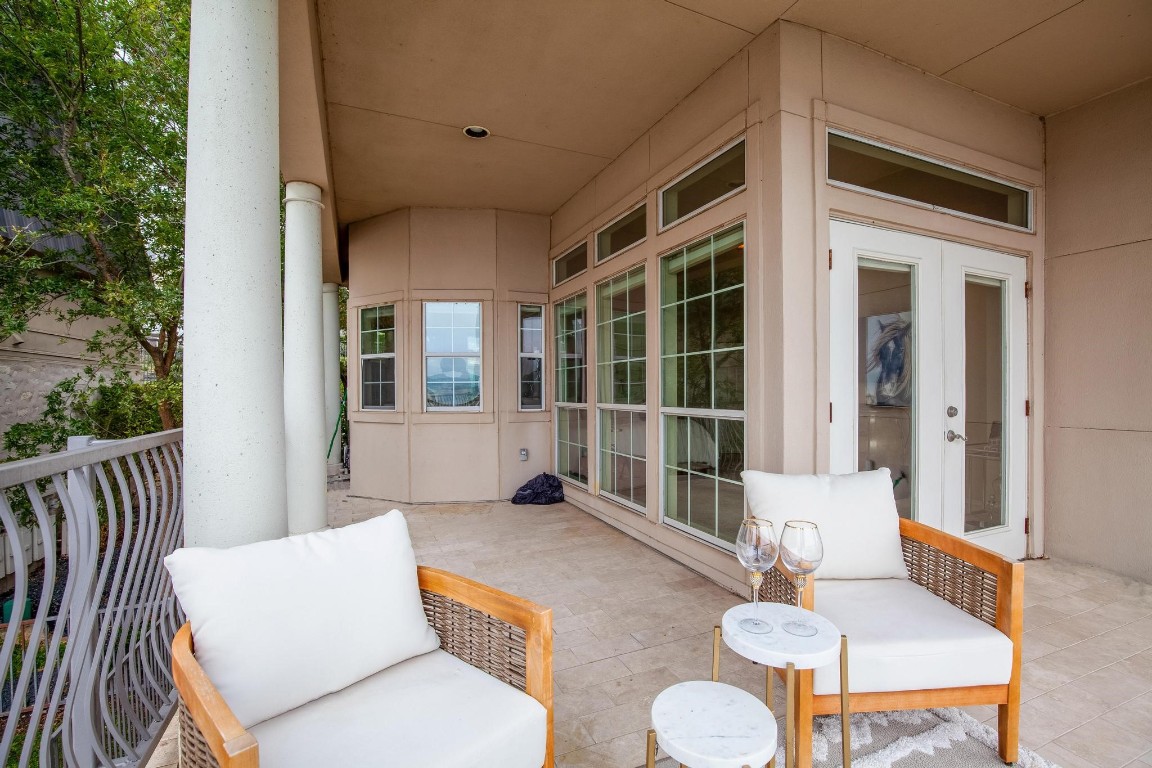 2918 Ranch Road 620 North, Unit L177 Austin, TX 78734 - Photo 31 of 40 a view of a patio with table and chairs and wooden floor