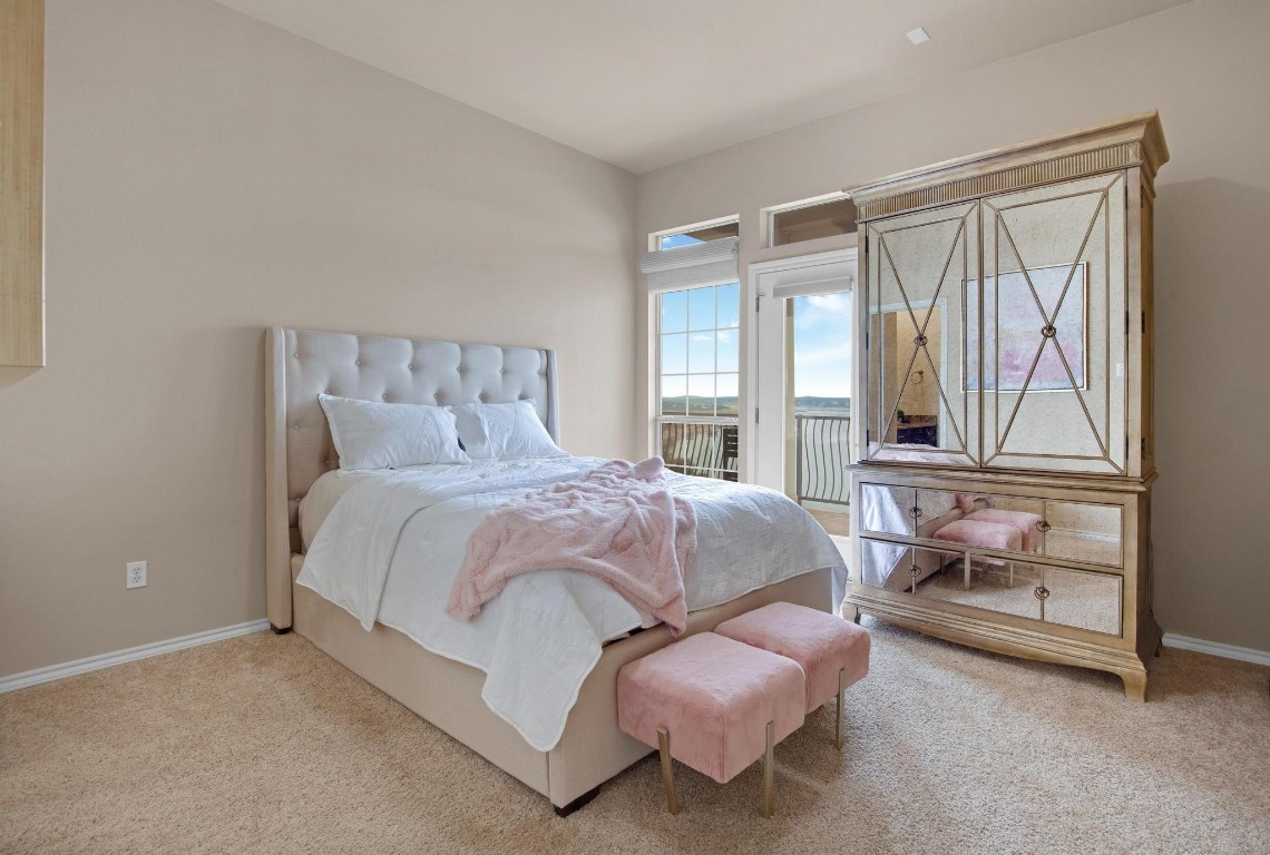 2918 Ranch Road 620 North, Unit L177 Austin, TX 78734 - Photo 32 of 40 a bedroom with a bed and large window