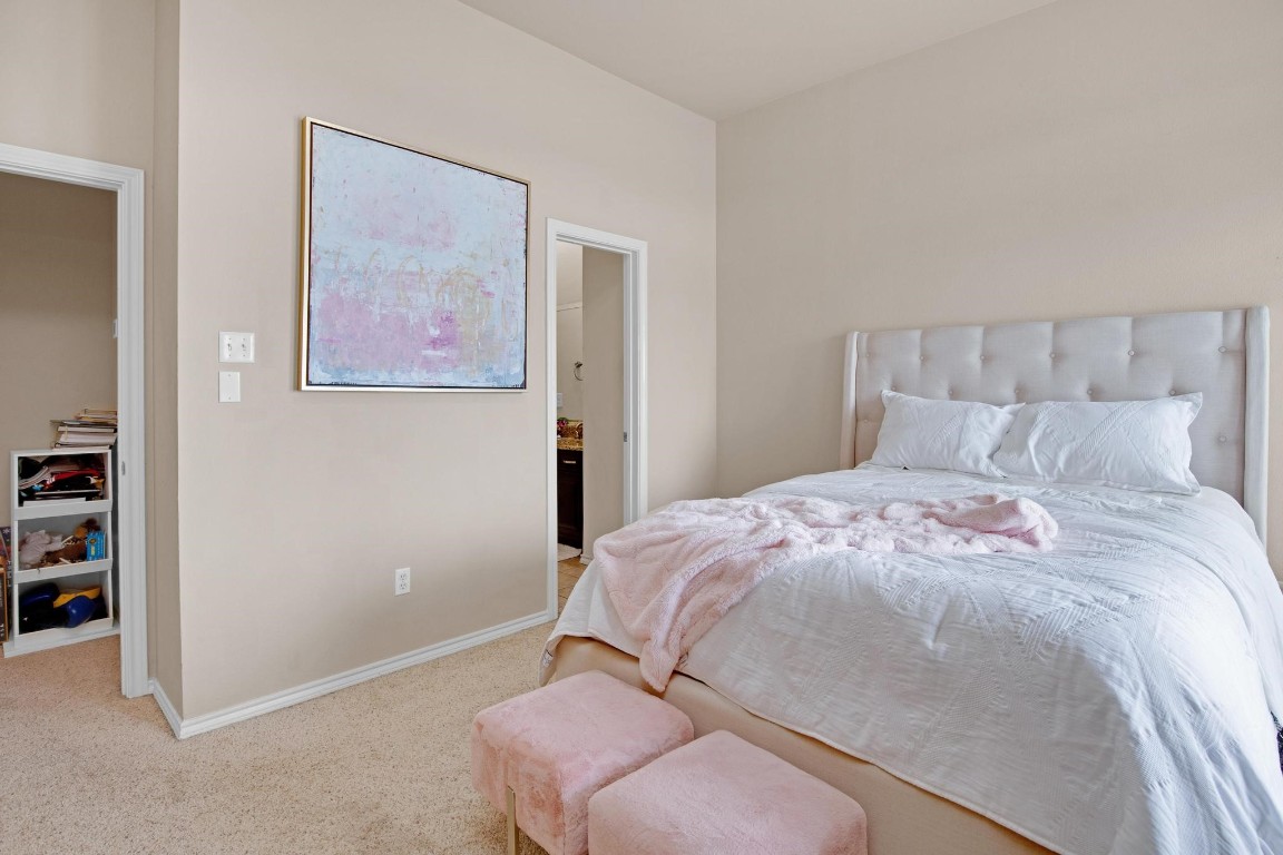 2918 Ranch Road 620 North, Unit L177 Austin, TX 78734 - Photo 33 of 40 a bedroom with a bed and a book shelf