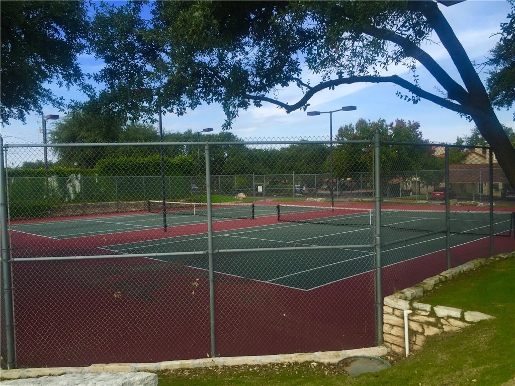 2918 Ranch Road 620 North, Unit L177 Austin, TX 78734 - Photo 39 of 40 a view of a tennis ground with large trees