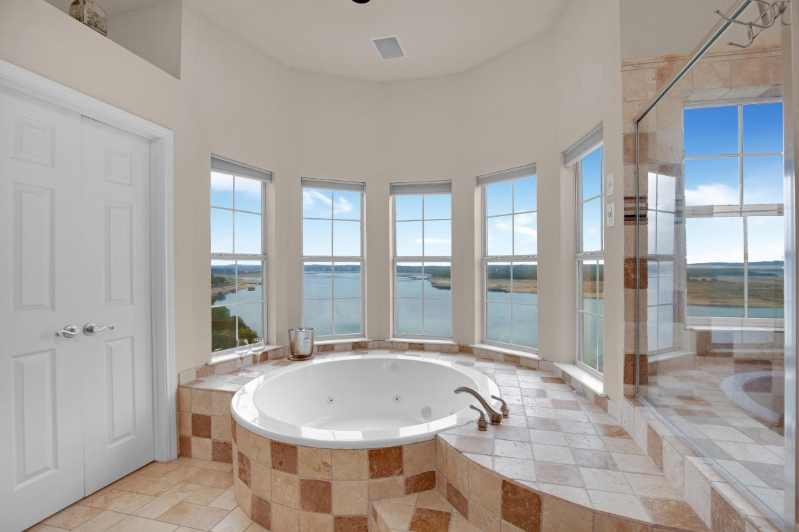 2918 Ranch Road 620 North, Unit L177 Austin, TX 78734 - Photo 6 of 40 a bathroom with a granite countertop sink and a large mirror