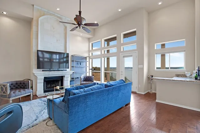 a room with pool table and windows