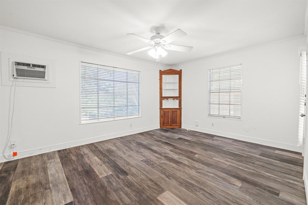 2326 Hartford Road Austin, TX 78703 - Photo 11 of 18 a view of an empty room with a window and wooden floor