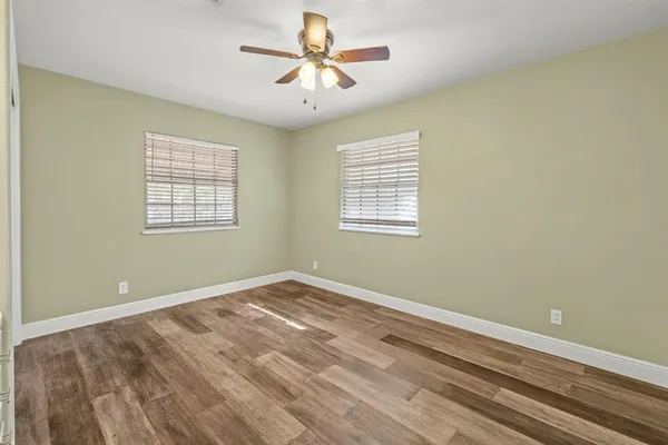 a view of room with window and ceiling fan