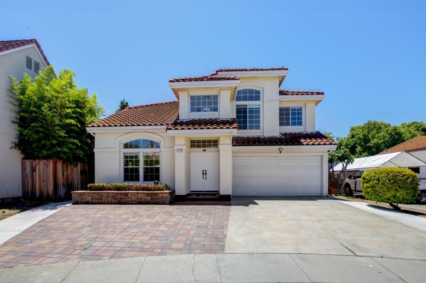 2699 Ramsdell Place San Jose, CA 95148 - Photo 1 of 40 a white building with a bench in front of it