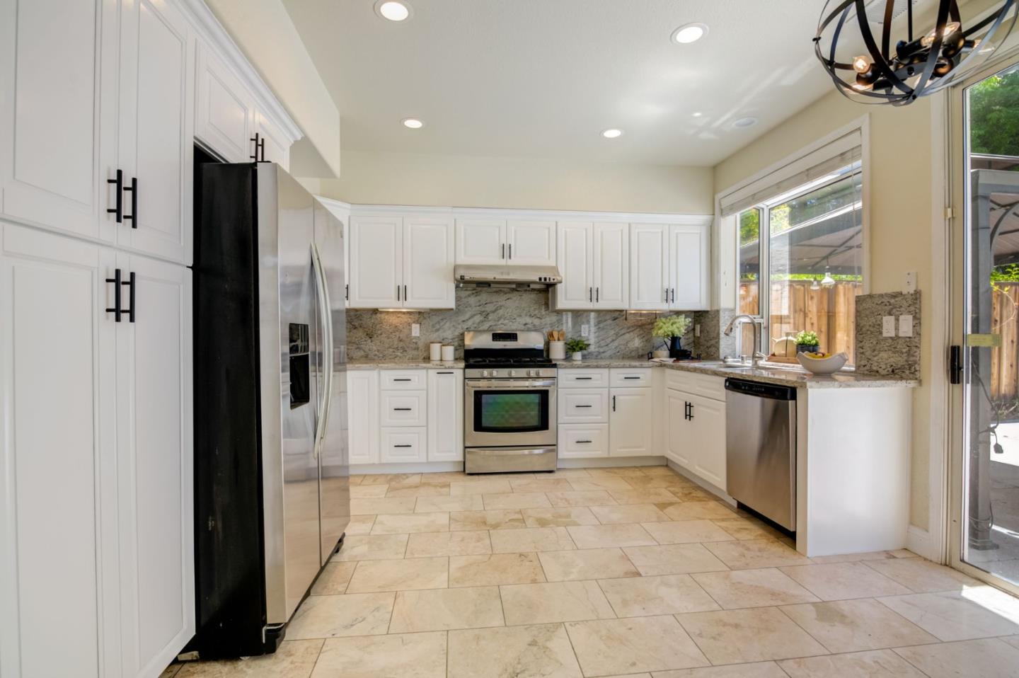 2699 Ramsdell Place San Jose, CA 95148 - Photo 12 of 40 a kitchen with stainless steel appliances a refrigerator sink and cabinets