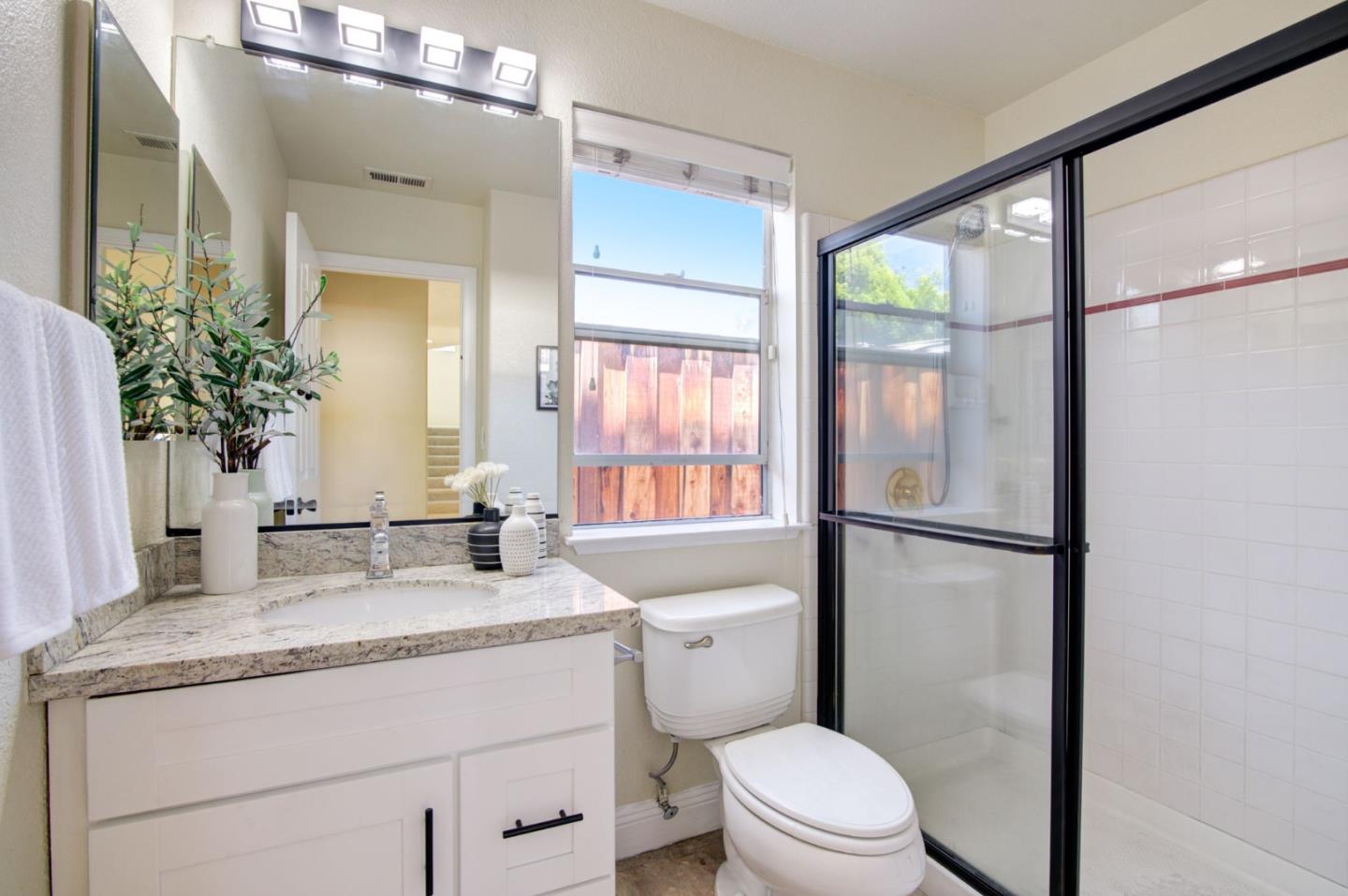2699 Ramsdell Place San Jose, CA 95148 - Photo 14 of 40 a bathroom with a granite countertop sink toilet and shower
