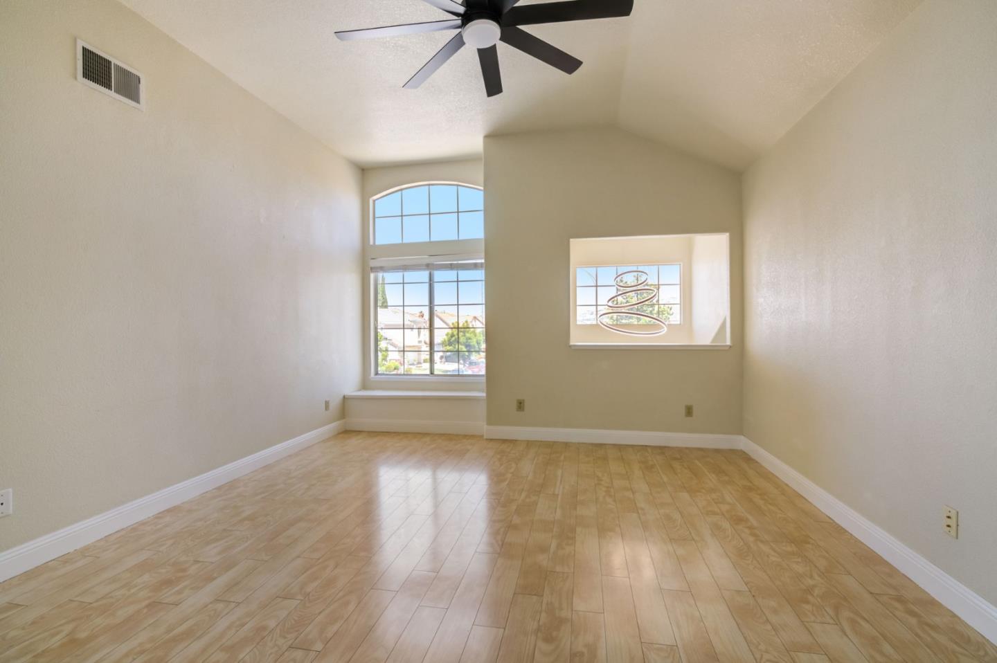 2699 Ramsdell Place San Jose, CA 95148 - Photo 16 of 40 a view of an empty room with a window and wooden floor