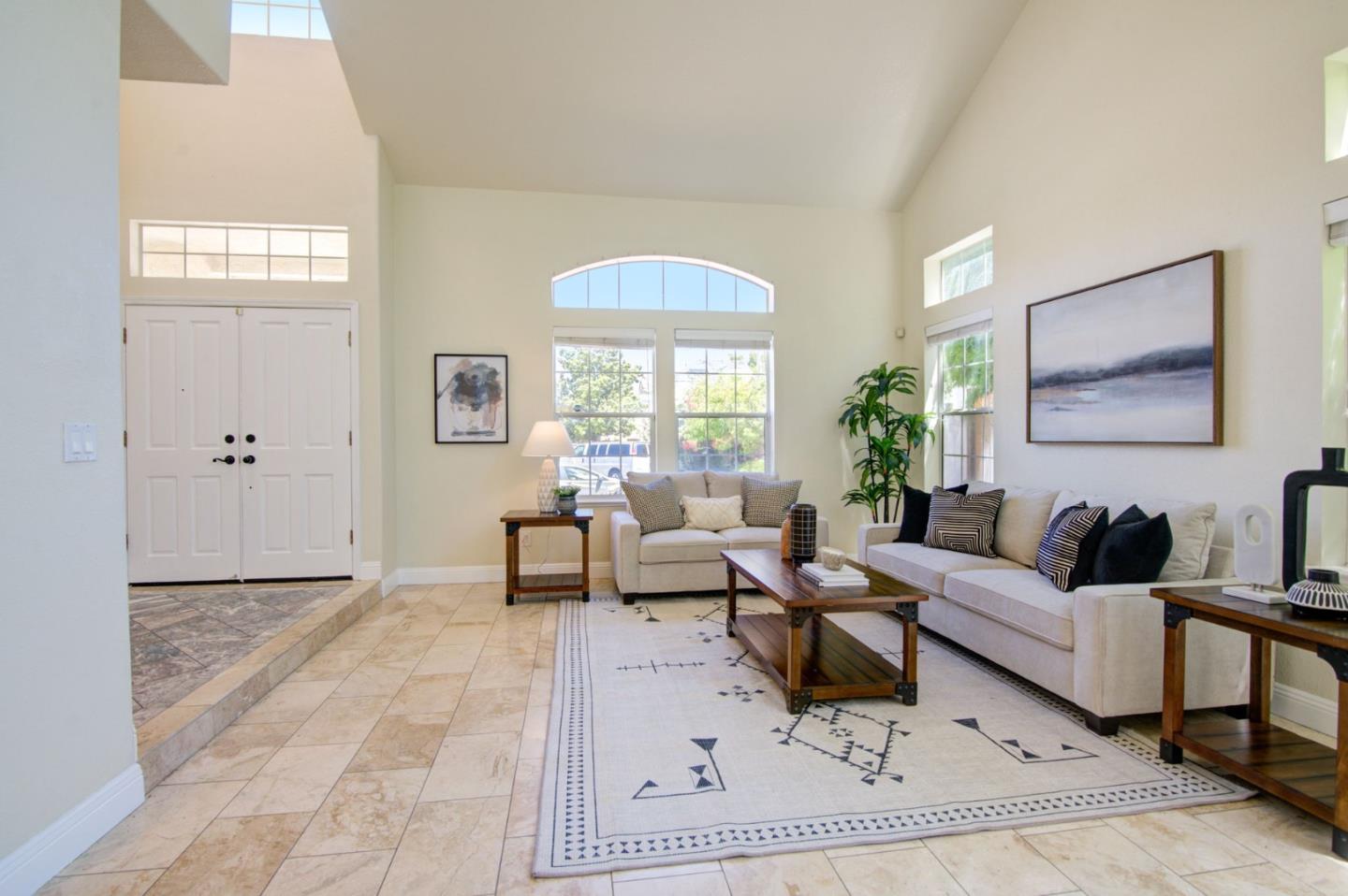 2699 Ramsdell Place San Jose, CA 95148 - Photo 2 of 40 a living room with furniture and a window