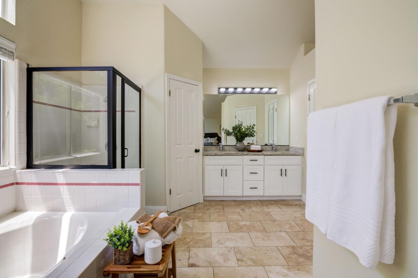 2699 Ramsdell Place San Jose, CA 95148 - Photo 21 of 40 a bathroom with a granite countertop sink a mirror and a shower