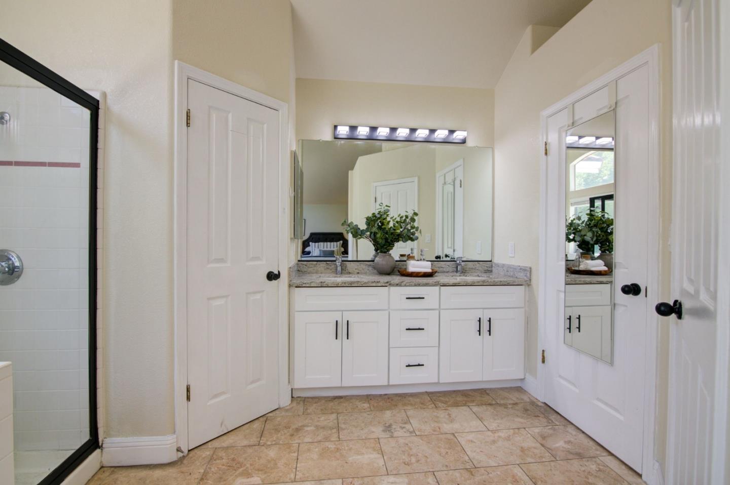 2699 Ramsdell Place San Jose, CA 95148 - Photo 22 of 40 a bathroom with a sink and a mirror