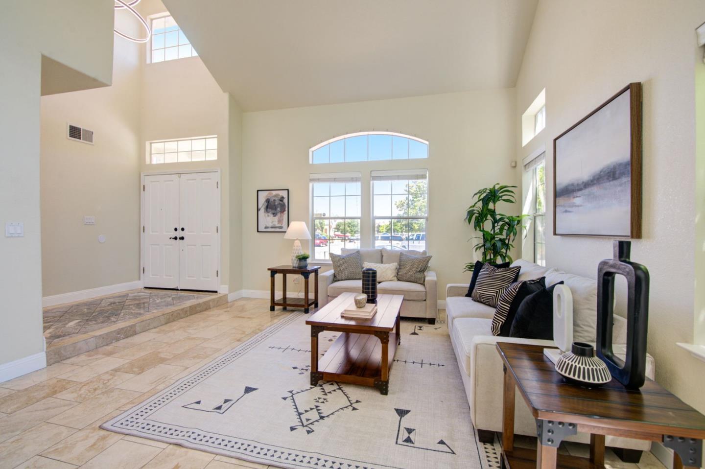 2699 Ramsdell Place San Jose, CA 95148 - Photo 3 of 40 a living room with furniture a window and a flat screen tv