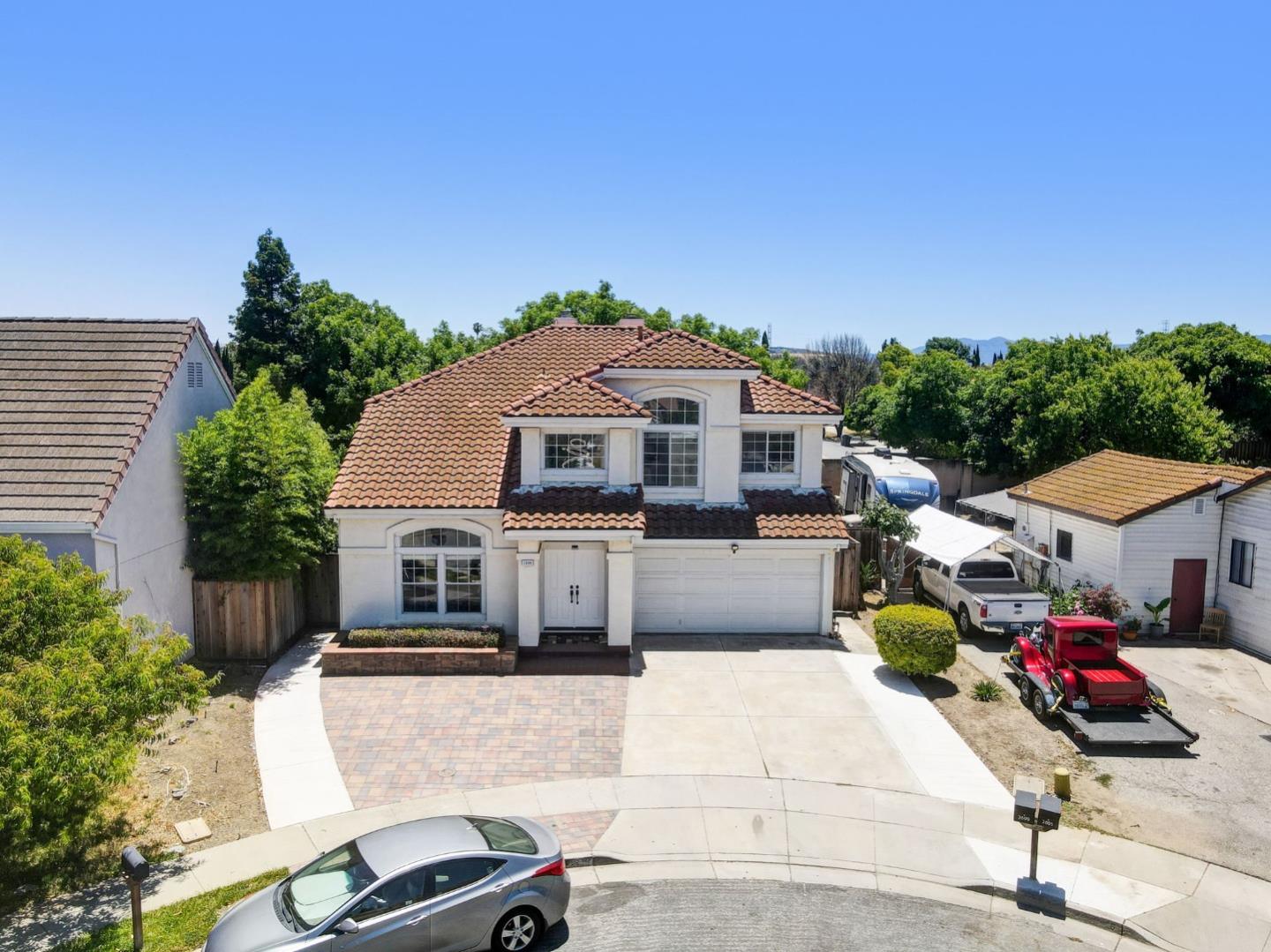 2699 Ramsdell Place San Jose, CA 95148 - Photo 33 of 40 a front view of a house with a garden and mountain