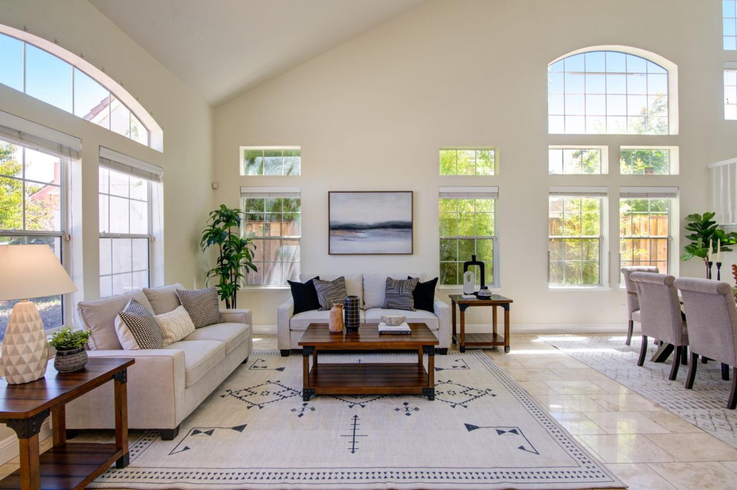 2699 Ramsdell Place San Jose, CA 95148 - Photo 6 of 40 a living room with furniture a table and large windows