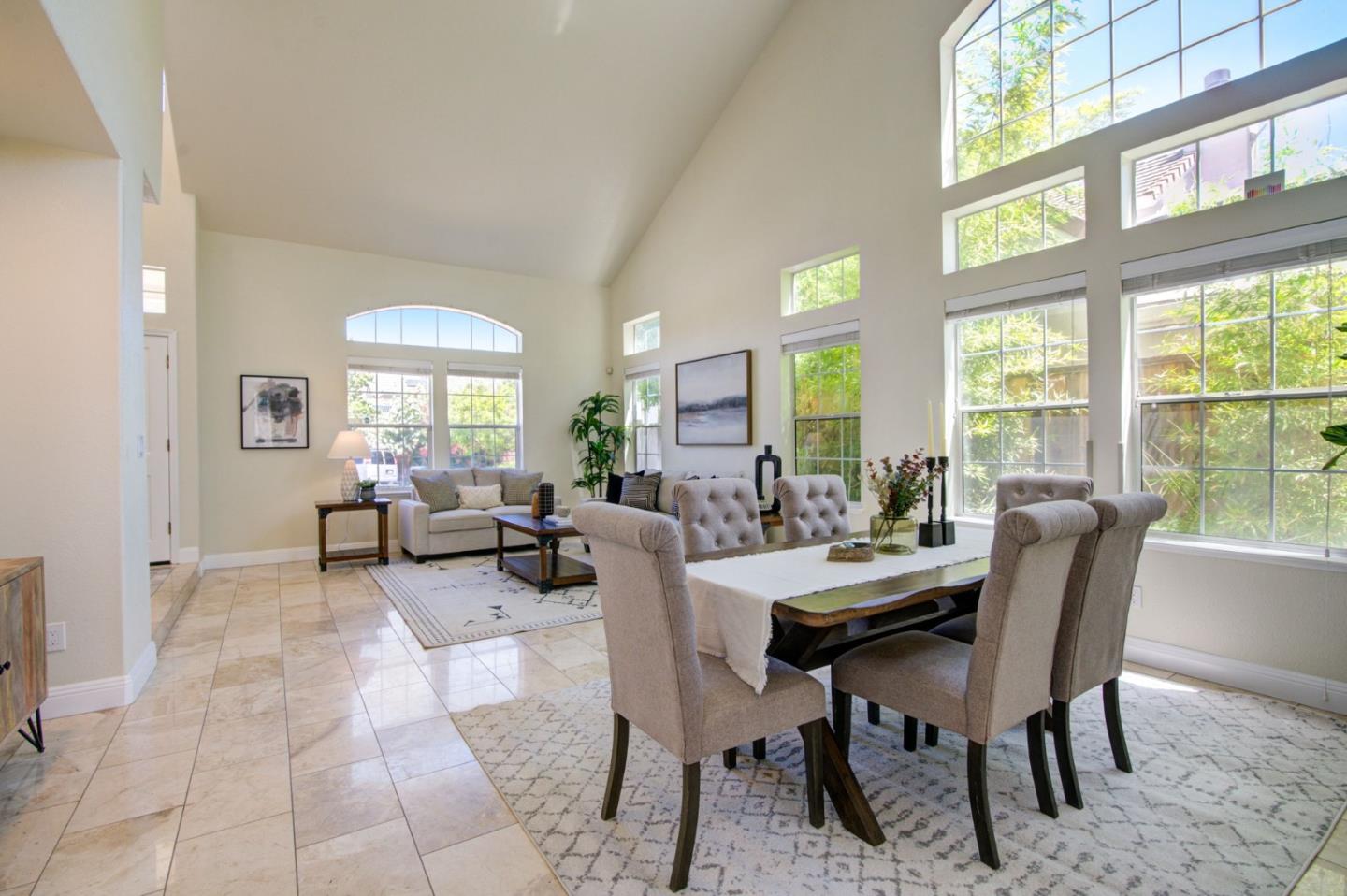 2699 Ramsdell Place San Jose, CA 95148 - Photo 7 of 40 a view of a dining room with furniture a rug and a large window