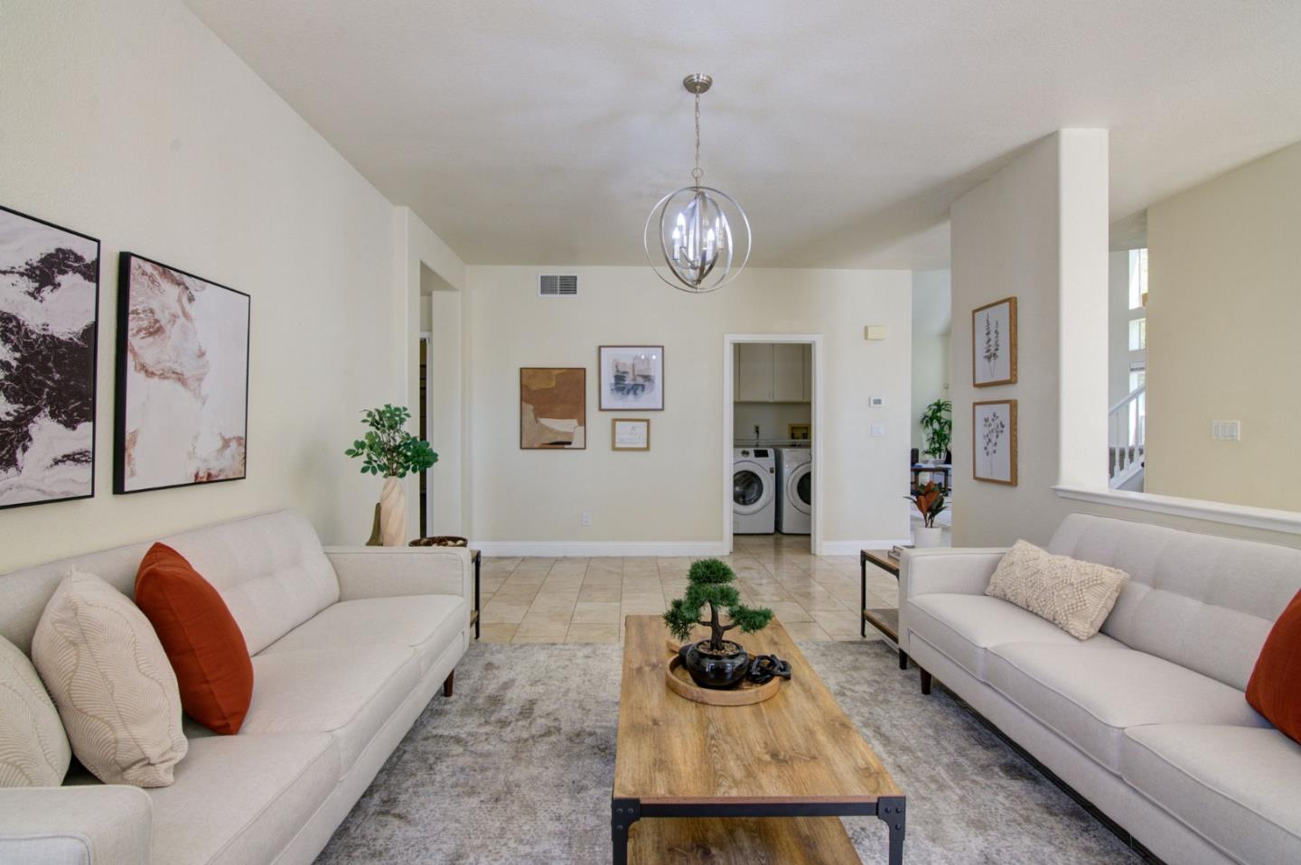 2699 Ramsdell Place San Jose, CA 95148 - Photo 9 of 40 a living room with furniture potted plant and kitchen view